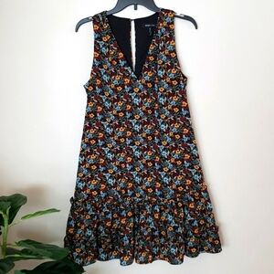 BCBG Paris dark floral sleeveless ruffle hem dress, v neck, keyhole back, size M